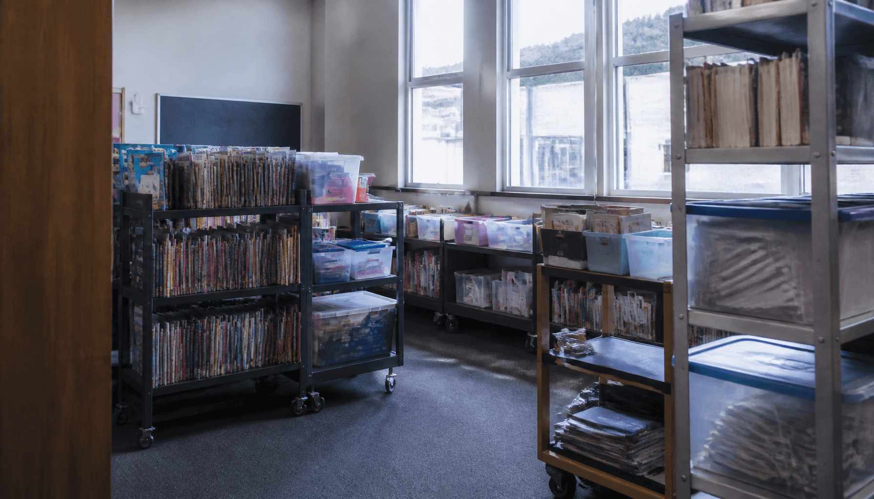 Book trolleys and topic boxes in a National Library school-services workroom