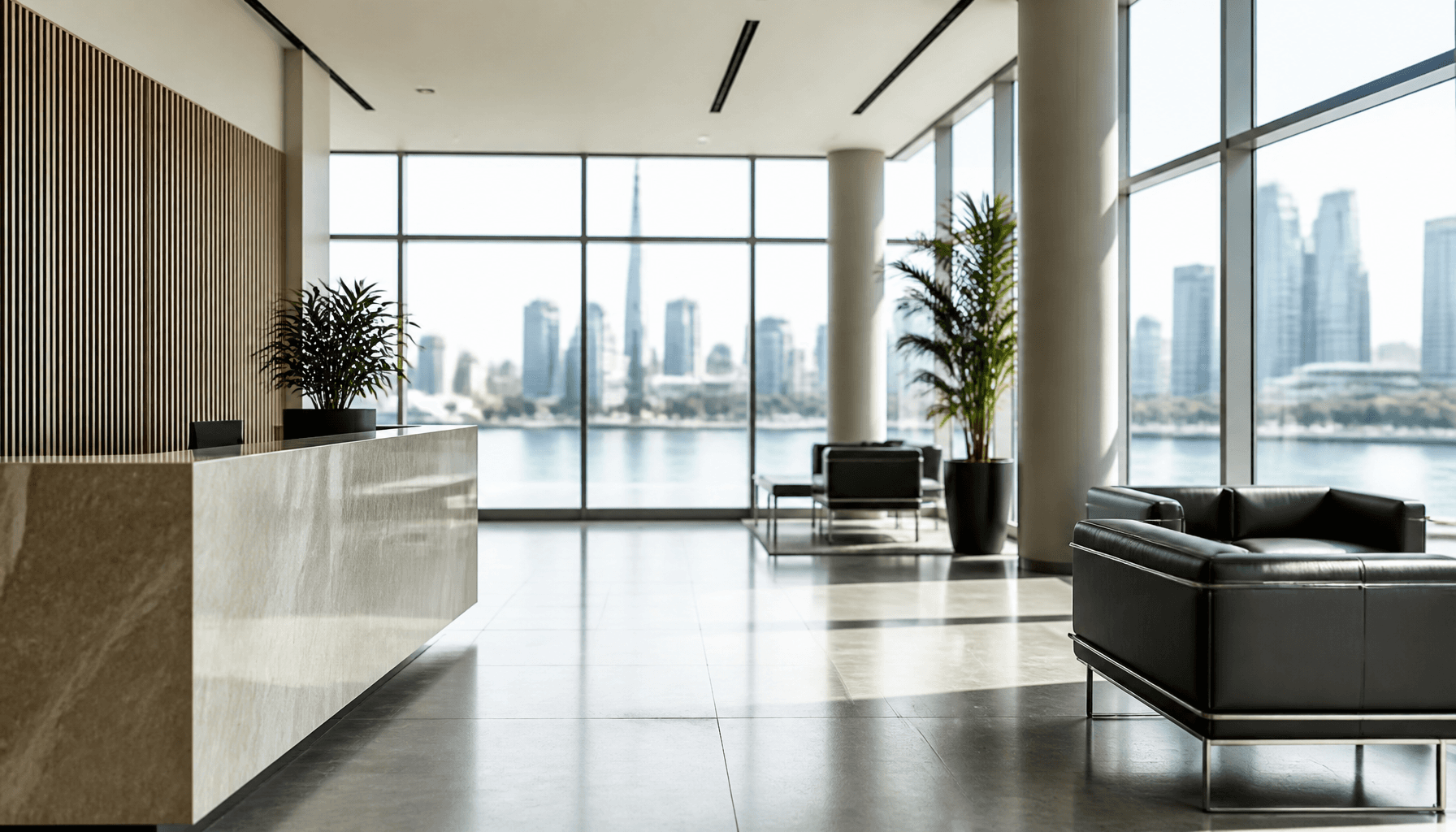 Empty modern Auckland office foyer with harbour light through glass