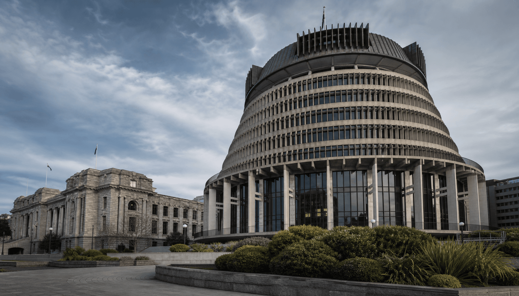 The Beehive executive wing and Parliament Buildings in Wellington under morning light.
