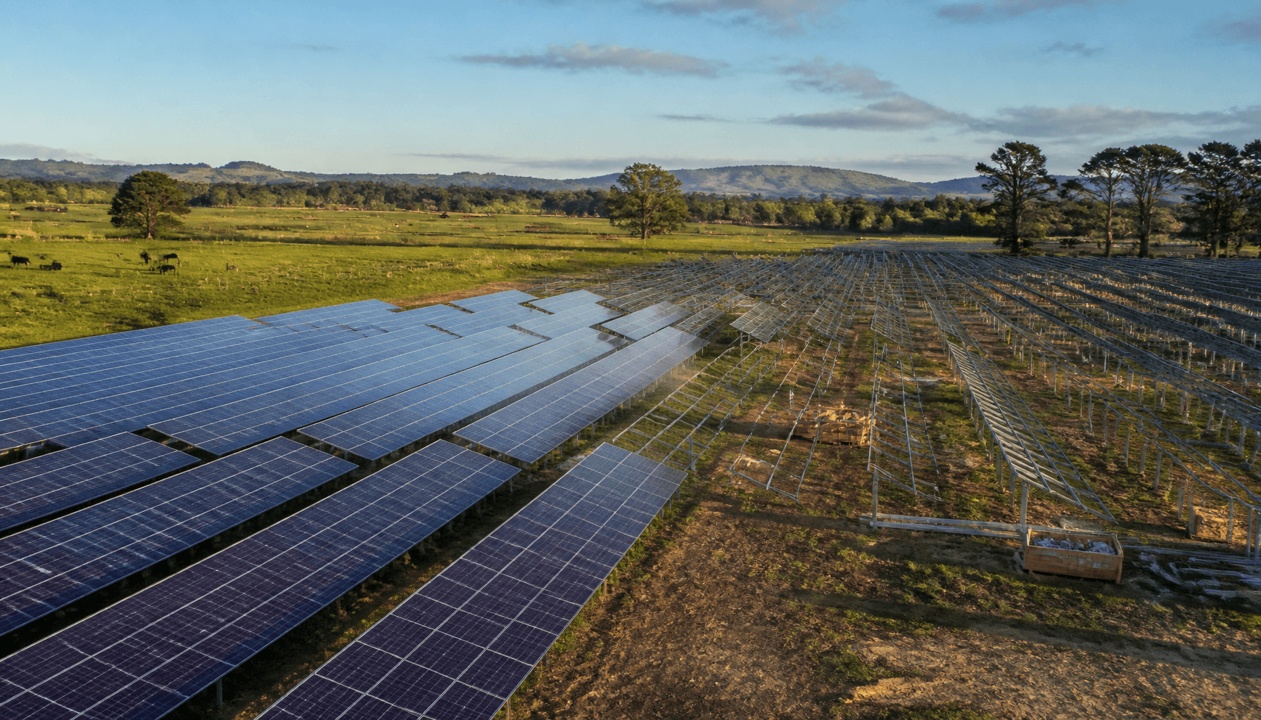 Utility-scale solar panels on rural New Zealand farmland under construction