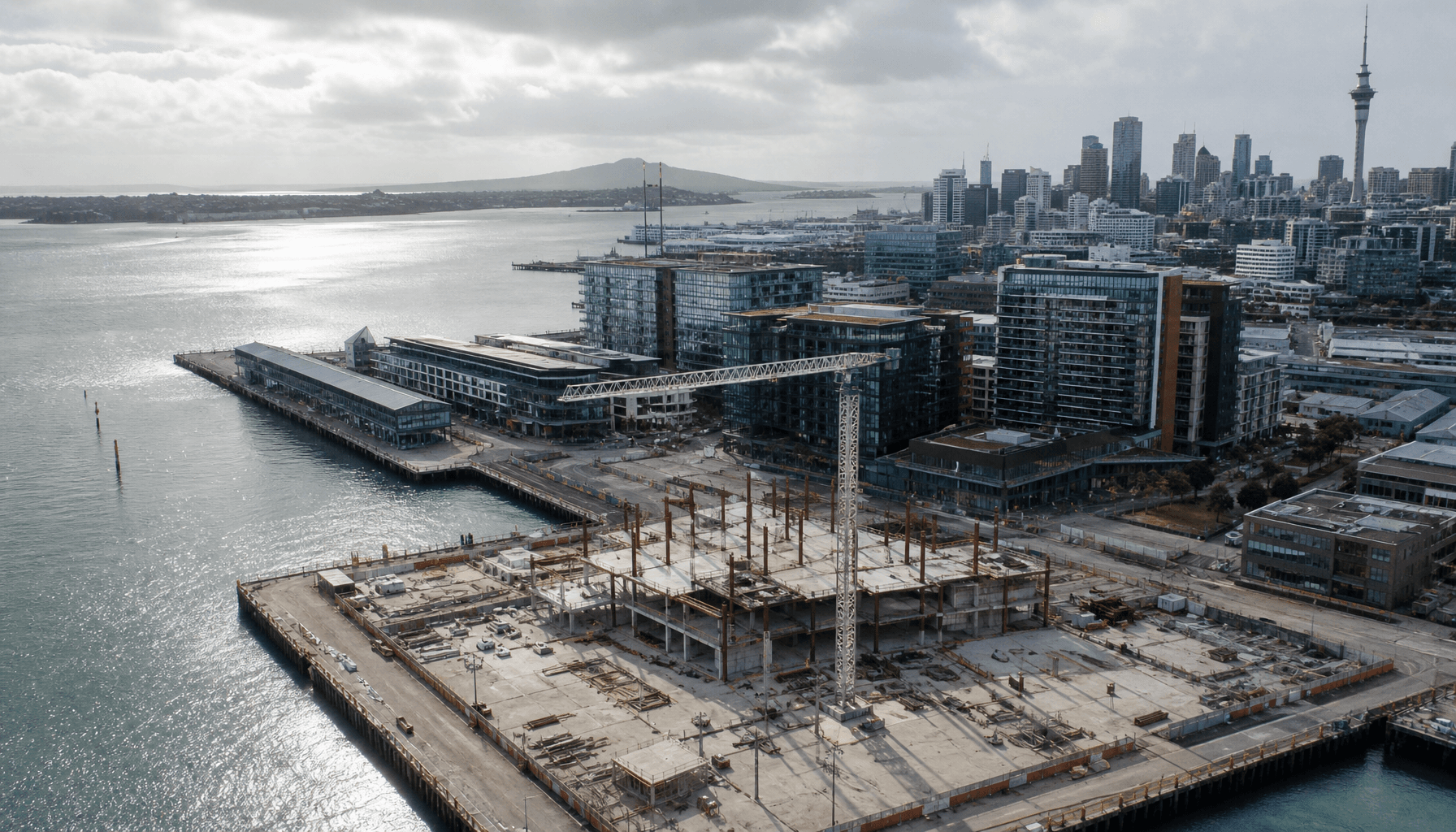 Aerial view of a North Wharf construction site in Auckland's Wynyard Quarter, with harbour beyond