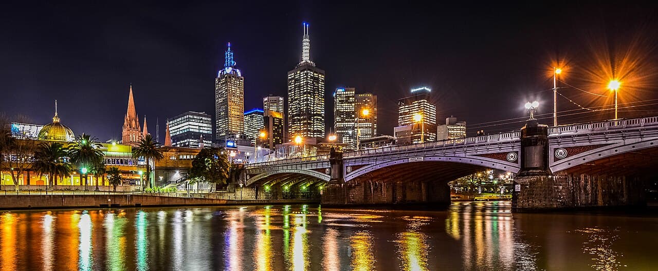 Melbourne CBD skyline at night reflected in the Yarra River, Australia's financial and economic heartland now facing its most serious headwinds in decades