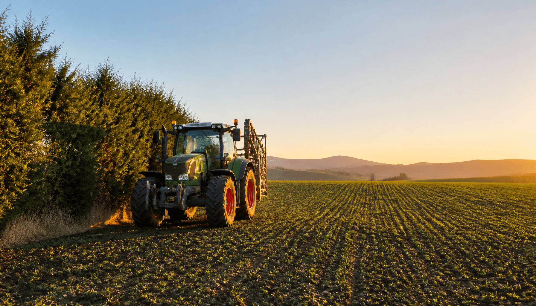New Zealand arable farm paddock with crop-protection equipment at dusk