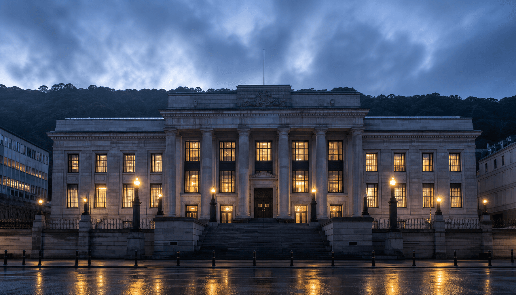 Reserve Bank of New Zealand building on The Terrace, Wellington, at pre-dawn blue hour with wet footpath reflections